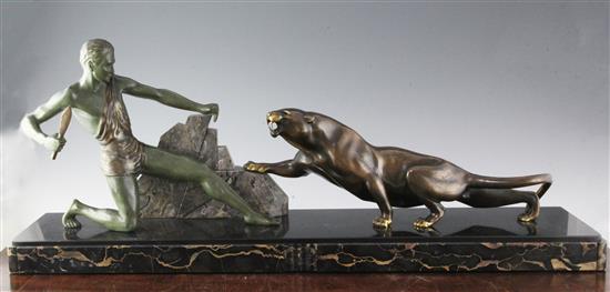 Brault. An Art Deco bronze and marble group of a huntsman and panther, 34in.